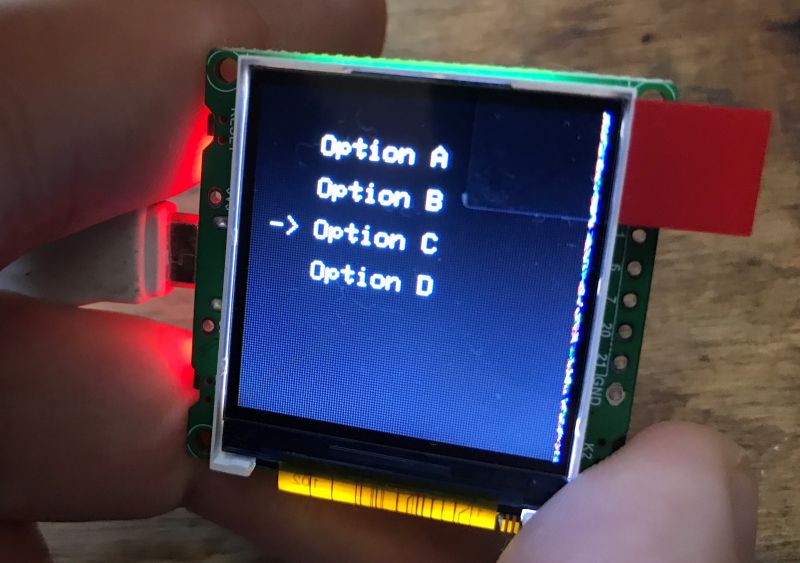 ESP32 C3 Module with LCD Display and Menu Small module with LCD display showing menu options.
