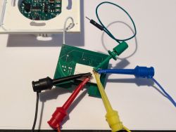 Switch Circuit Board with Test Leads Close-up of a switch circuit board with connected test leads.