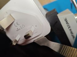 UK Smart Plug with CE and RoHS Certifications Close-up of a white UK smart plug with a three-pin connector and visible CE and RoHS certifications.