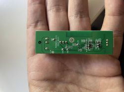 RGB/MIC-R v1.0 PCB held in hand Green circuit board with electronic components held in a hand.
