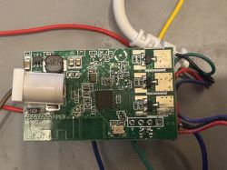 Printed circuit board with SMD components and wire connections PCB with surface-mounted components and connected colored wires