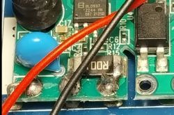 Close-up of a circuit board featuring a BL0937 chip and soldered wires.