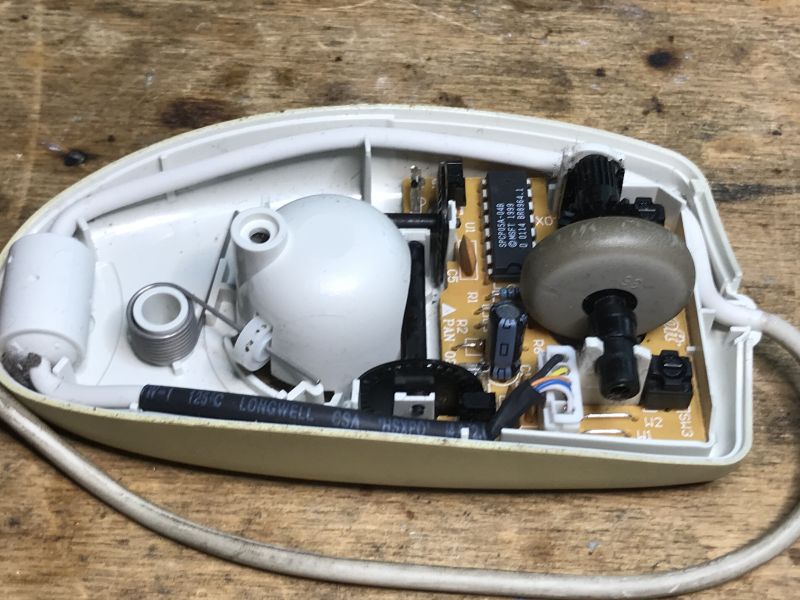 Interior of an Old Ball Mouse Interior of an old ball mouse showing electronic components.