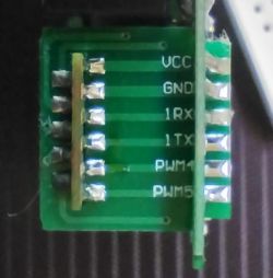 Side view of the XY-WE2S-A module showing pins: VCC, GND, 1RX, 1TX, PWM4, PWM5.