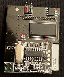 Image of a circuit board with an RN8209C chip and red and green dots indicating connection points.