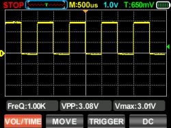 A digital oscilloscope screen displaying a square waveform at 1 kHz frequency.