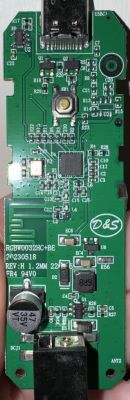 Close-up of a circuit board with various electronic components and a USB-C connector.