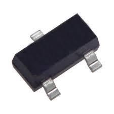 Close-up of a small black PNP transistor with three metal legs and the marking “028” on its surface.