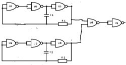 Schemat elektroniczny z bramkami logicznymi, kondensatorami i rezystorami.