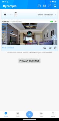 Camera preview in the ftycampro app Screenshot of a mobile surveillance app showing a live camera view of a living room.