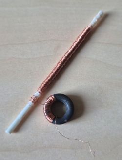 Two coil cores with copper wire: one ferrite rod and one toroidal core