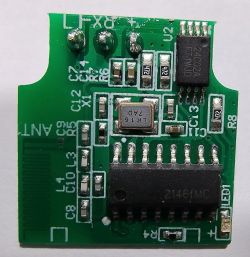 Close-up of a green circuit board with various electronic components, intended for wireless module installation.