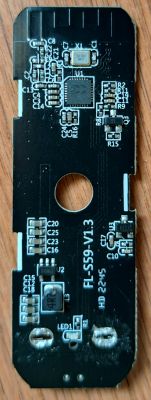 A printed circuit board with electronic components, visible processor, capacitors, and resistors.