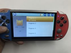 X12 handheld game console with blue and red sides, showing “Progress 1–4” menu on screen