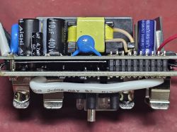 Close-up of electronic module with capacitors, transformer, and wires