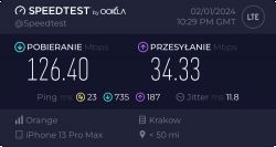Wyniki testu prędkości internetu na iPhone 13 Pro Max z parametrami pobierania 126.40 Mbps i wysyłania 34.33 Mbps.