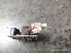 Curtain Module with Electronic Components Electronic board with visible components, including a capacitor and wires.