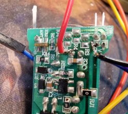 Connecting Wires to LED Circuit Board Printed circuit board with wires connected to various solder points.