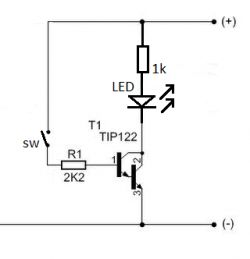 Schemat układu elektronicznego z tranzystorem TIP122, rezystorem i diodą LED.