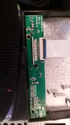 Image of a green circuit board with details and connecting wires.