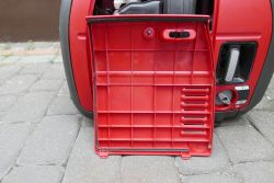 Open Casing of Honda EU22i Generator Photo of an open casing of a red Honda EU22i generator, showing access to the interior.