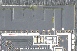 Close-up of a black PCB with markings Nie działa and dimensions 14.5 mm and 5 mm.