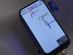 ESP32-C6-LCD-1.47 wyświetlający benchmark graficzny LVGL z widocznymi liniami i danymi o wydajności