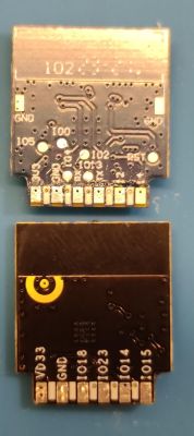 Comparison of RTL8710BX and ESP-02S Modules Comparison of RTL8710BX and ESP-02S PCB modules on a blue background.