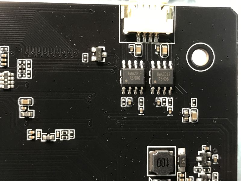 Close-up of two HAA2018 A5N06 chips on a black PCB with nearby components
