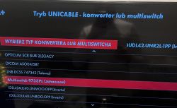 Ekran telewizora z menu wyboru konwertera lub multiswitcha w trybie UNICABLE.