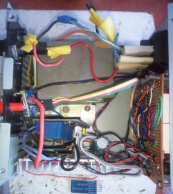 Internal view of transformer-based charger with electronics and wires