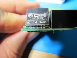 Wi-Fi/Bluetooth module ESPC2-02 on a PCB with markings.