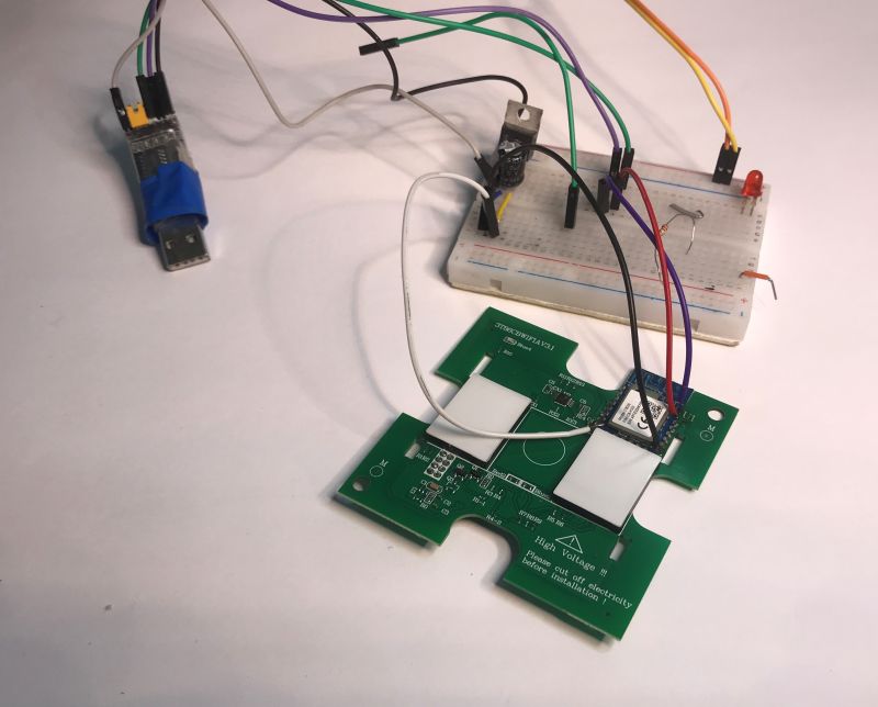 Disassembled ATLO-TB2-TUYA two-gang light switch with exposed electronics and CB3S module.