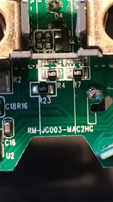 Close-up of a circuit board with visible electronic components, markings, and traces.