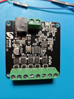 Motherboard with electronic components on a blue background.