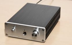 Headphone Amplifier with Metal Case Headphone amplifier in a metal case with front buttons.