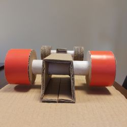 Model deskorolki z tektury z widocznymi miejscami na układy LED.