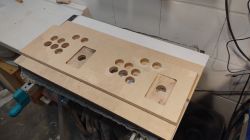 Plywood Arcade Machine Panel Plywood front panel of arcade machine with button holes.