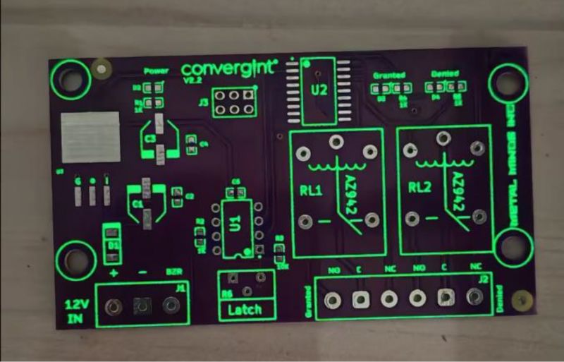 Printed circuit board with electronic component markings and mounting holes.