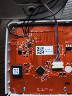 Close-up of a PCB with labeled MCU-TX and MCU-RX pins and connected cables