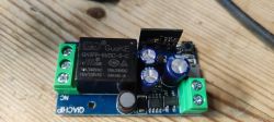 Qiachip relay module with electronic components.