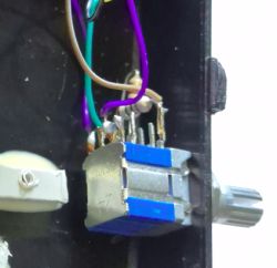 Close-up of a 4-position rotary switch inside a DIY radio case