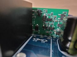 Close-up of an electronic module with visible PCBs and SMD components.