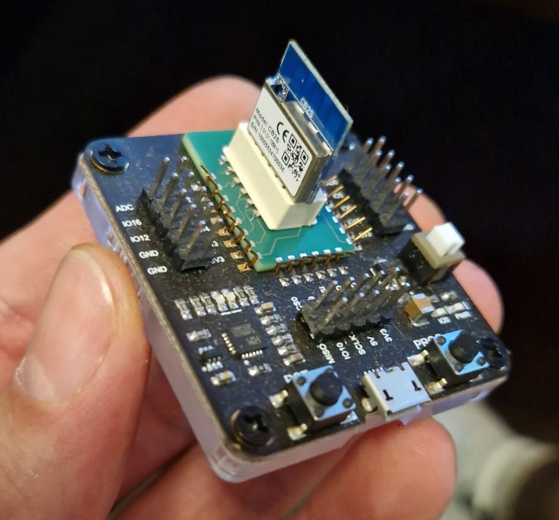 CB2S Adapter on PCB CB2S module mounted on a PCB held in a hand