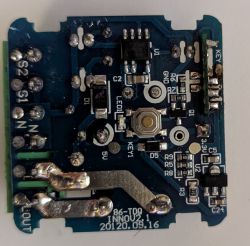 Close-up of Nedis device PCB with button, labeled pins, and soldered components visible