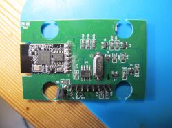 MCU iComm SV6060P circuit board inside an ELM327 device with visible electronic components.