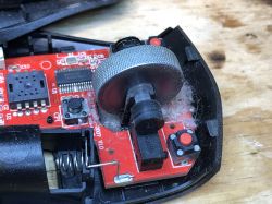 BW-MO2 Mouse Interior and Cleaning Interior of a BW-MO2 wireless mouse covered in dust.