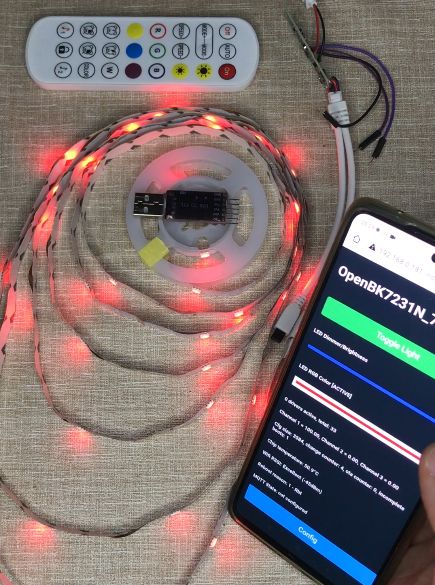 RGB LED strip kit with remote, controller module, and a phone showing the OpenBK7231N interface