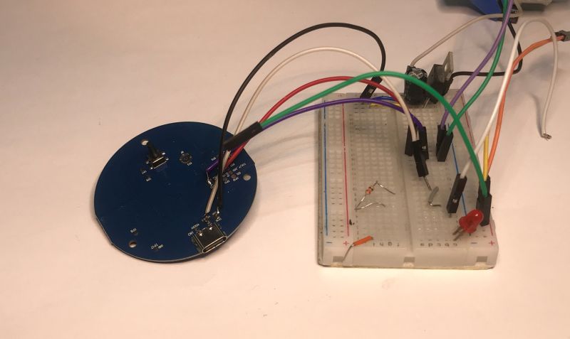 Tuya IR PCB connected to a breadboard with jumper wires and electronic components