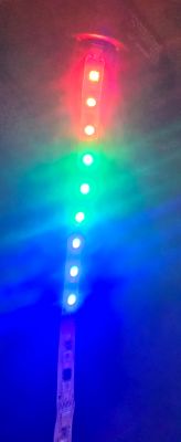 LED strip with nine diodes displaying red, green, and blue colors.
